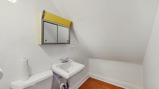 1320 Oak Park Ave, Berwyn, IL 60402 - bathroom featuring wood finished floors and vaulted ceiling