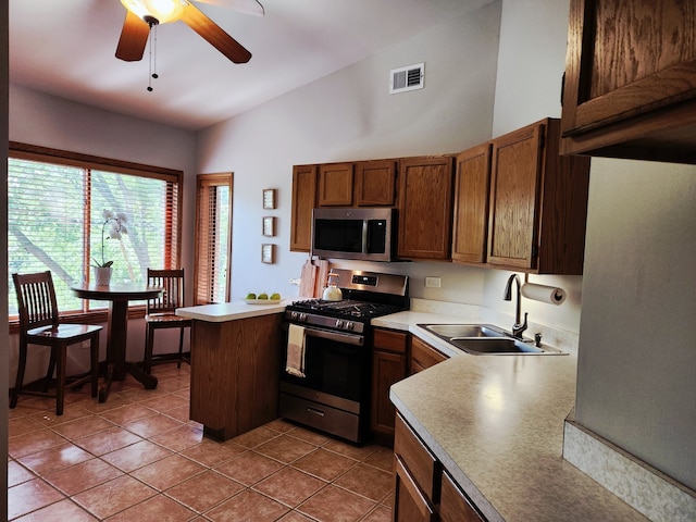 9410 S 77th Ct Unit 3F, Hickory Hills, IL 60457 - kitchen featuring stainless steel appliances, ceiling fan, a peninsula, light countertops, and high vaulted ceiling