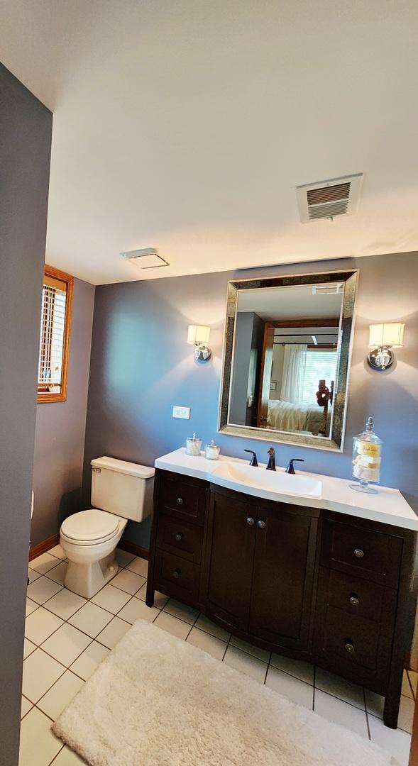 9410 S 77th Ct Unit 3F, Hickory Hills, IL 60457 - bathroom with vanity and tile patterned flooring