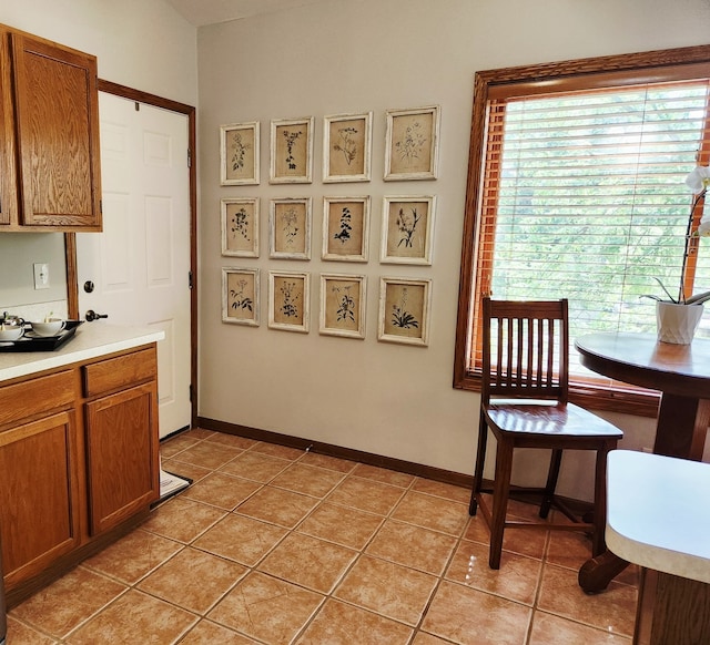 9410 S 77th Ct Unit 3F, Hickory Hills, IL 60457 - dining space with light tile patterned floors and baseboards