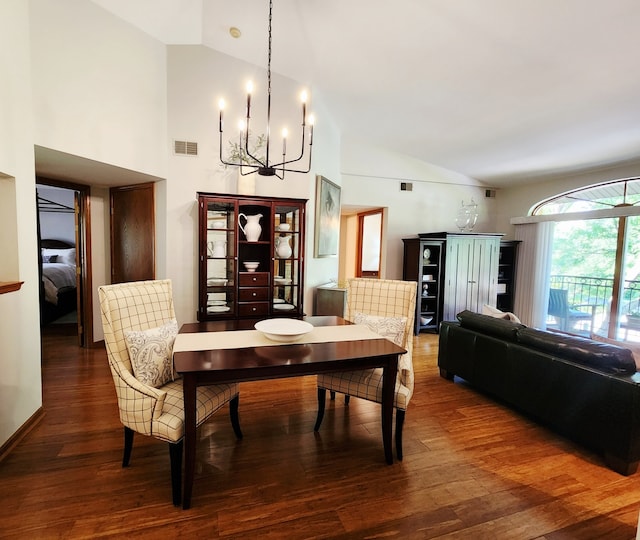 9410 S 77th Ct Unit 3F, Hickory Hills, IL 60457 - dining space featuring a chandelier, wood finished floors, and high vaulted ceiling