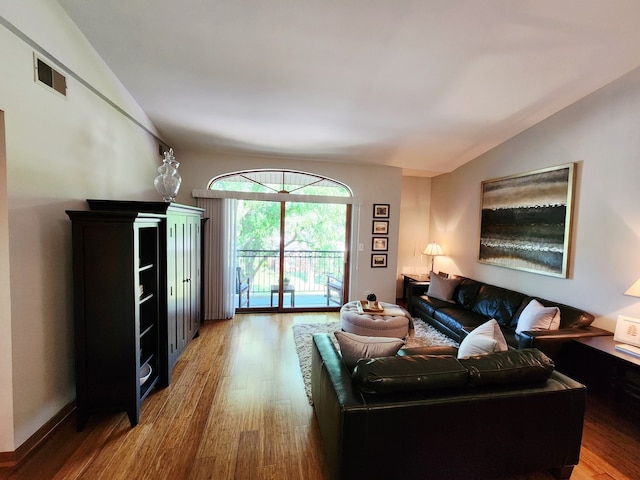 9410 S 77th Ct Unit 3F, Hickory Hills, IL 60457 - living room featuring vaulted ceiling and wood finished floors