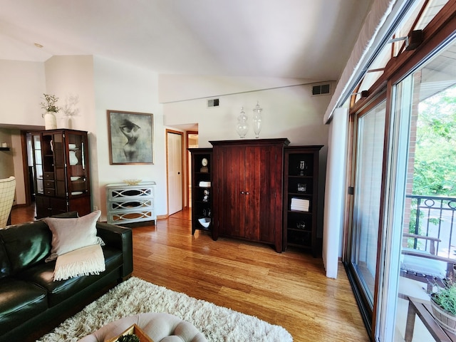 9410 S 77th Ct Unit 3F, Hickory Hills, IL 60457 - living area with light wood-style floors and lofted ceiling