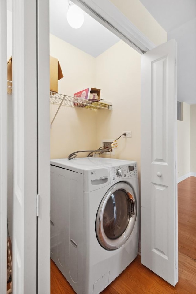 3033 N Sheridan Rd Unit 603, Chicago, IL 60657 - laundry room featuring washer / dryer and light wood-type flooring