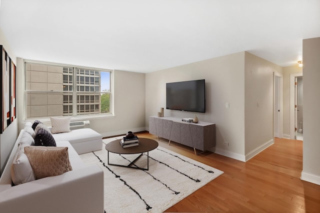 3033 N Sheridan Rd Unit 603, Chicago, IL 60657 - living area with light wood-style flooring and an AC wall unit