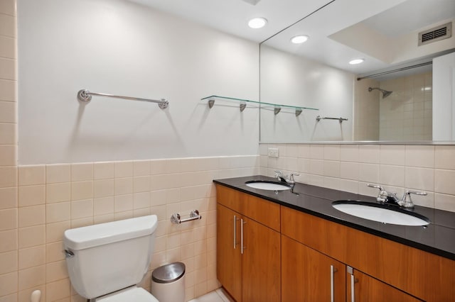 3033 N Sheridan Rd Unit 603, Chicago, IL 60657 - full bath with tile walls, double vanity, a shower, and recessed lighting