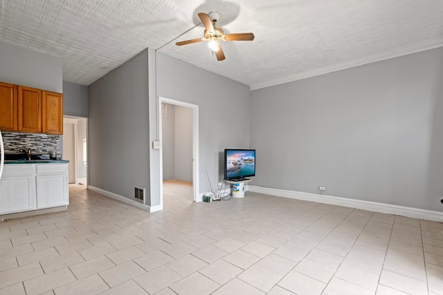 2713 W 24th Pl, Chicago, IL 60608 - unfurnished living room with ceiling fan and baseboards