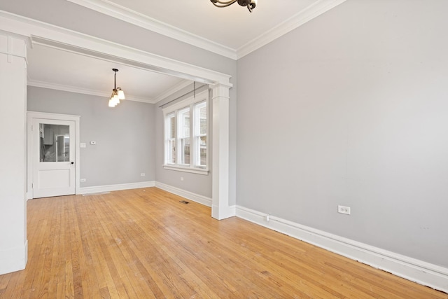 2713 W 24th Pl, Chicago, IL 60608 - unfurnished room featuring light wood-style flooring, ornamental molding, and a chandelier