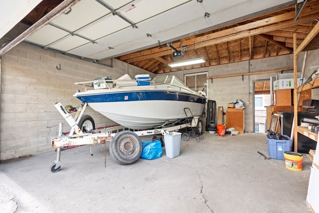 2713 W 24th Pl, Chicago, IL 60608 - garage featuring a garage door opener and concrete block wall