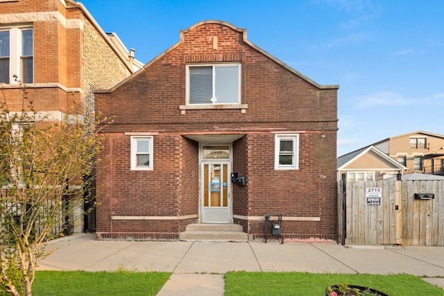 2713 W 24th Pl, Chicago, IL 60608 - view of front of house with brick siding and a gate