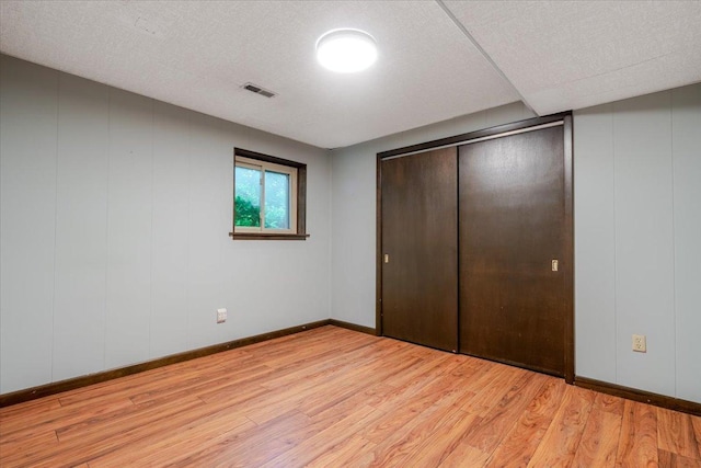 106 Sandra Ln, Normal, IL 61761 - unfurnished bedroom with light wood-type flooring and a closet