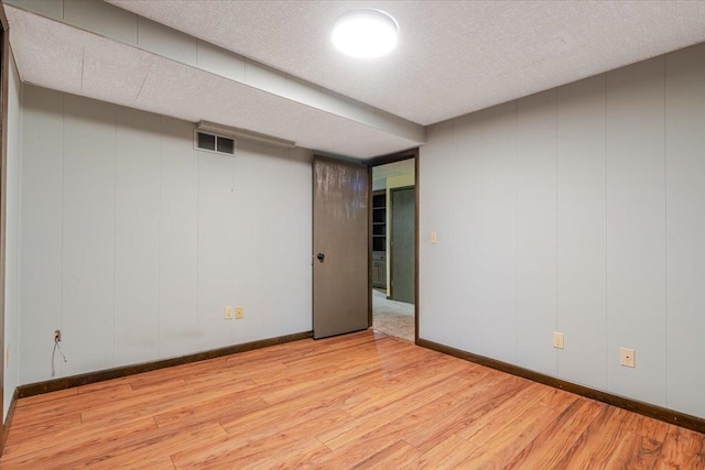 106 Sandra Ln, Normal, IL 61761 - finished basement featuring wood finished floors and a textured ceiling