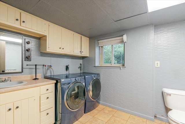 106 Sandra Ln, Normal, IL 61761 - laundry room with independent washer and dryer and light tile patterned floors