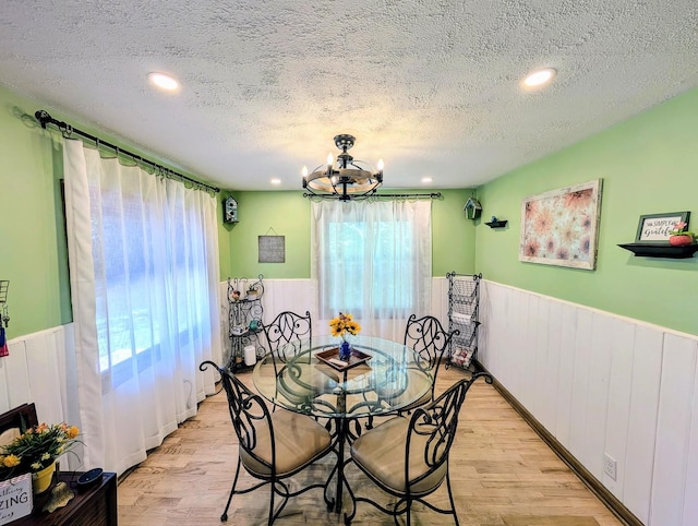 1274 N Cooper Rd, New Lenox, IL 60451 - dining space featuring wainscoting, a textured ceiling, light wood-style floors, a chandelier, and recessed lighting