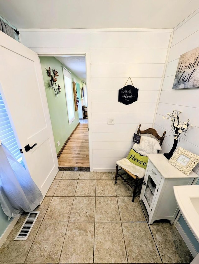 1274 N Cooper Rd, New Lenox, IL 60451 - bathroom with healthy amount of natural light, tile patterned flooring, and wooden walls
