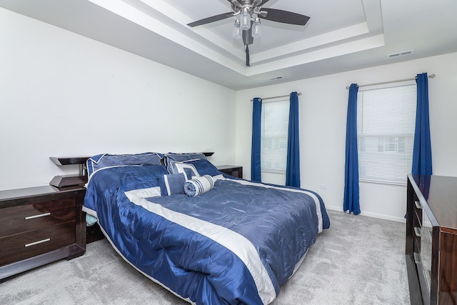 277 Lakeshore Dr, Oswego, IL 60543 - bedroom featuring carpet floors, a raised ceiling, and ceiling fan