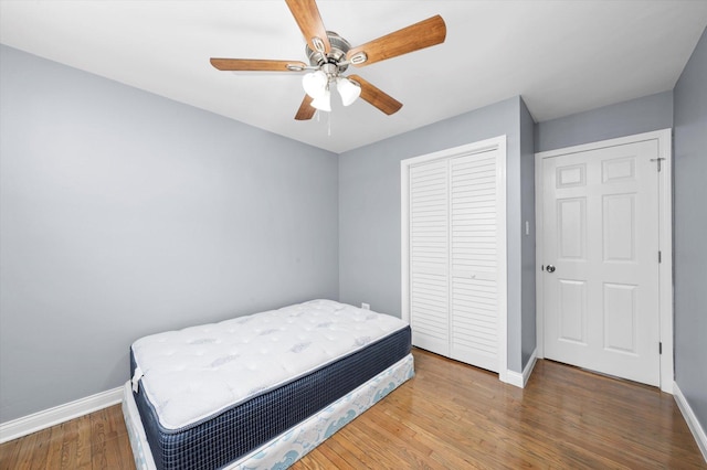 7133 S Honore St, Chicago, IL 60636 - bedroom featuring a closet, wood finished floors, and a ceiling fan