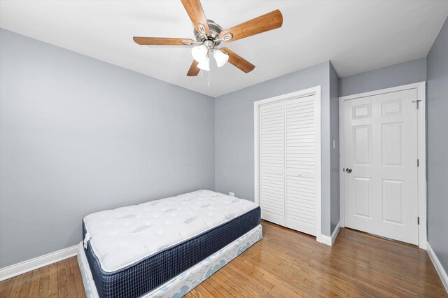7133 S Honore St, Chicago, IL 60636 - bedroom featuring a closet, wood finished floors, and ceiling fan