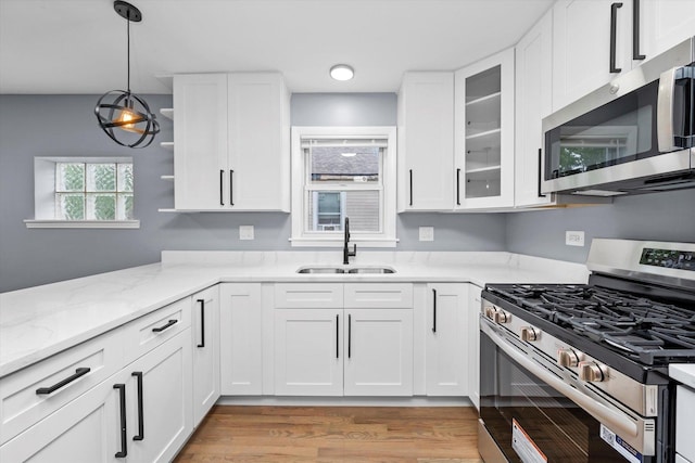 7133 S Honore St, Chicago, IL 60636 - kitchen featuring appliances with stainless steel finishes and white cabinetry
