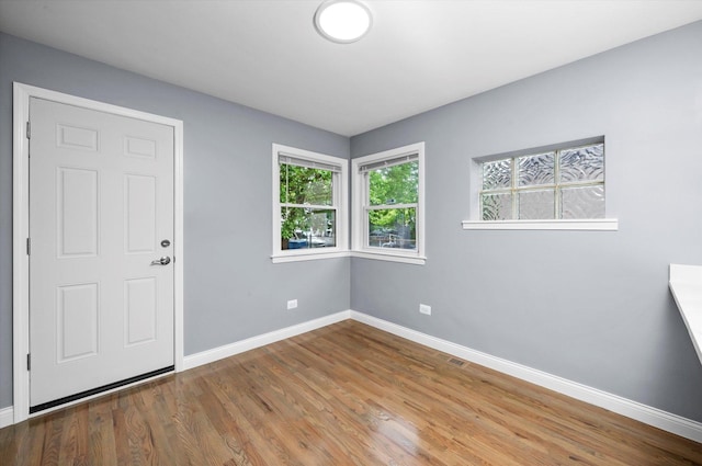 7133 S Honore St, Chicago, IL 60636 - spare room featuring baseboards and wood finished floors