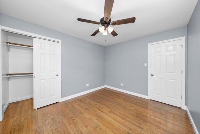 7133 S Honore St, Chicago, IL 60636 - unfurnished bedroom with wood finished floors, a closet, and ceiling fan