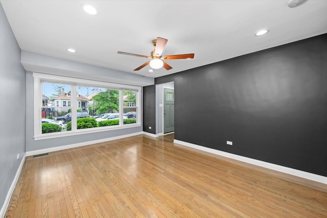 7133 S Honore St, Chicago, IL 60636 - empty room with light wood-type flooring, ceiling fan, and recessed lighting