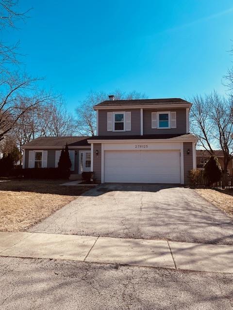 27W125 Chestnut Ln, Winfield, IL 60190 - traditional home featuring an attached garage and asphalt driveway