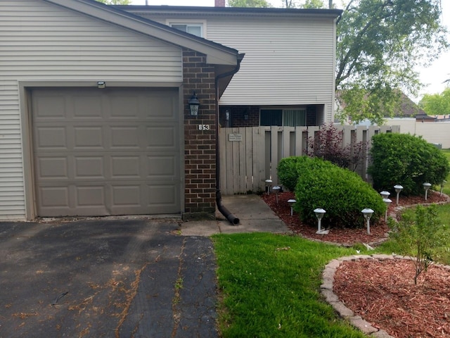 853 Greenbriar Ln, University Park, IL 60484 - garage with asphalt driveway