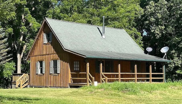 11 Cedar Ln, Putnam, IL 61560 - rear view of property featuring board and batten siding, a lawn, and a porch