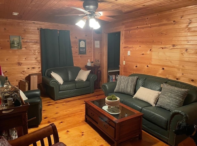 11 Cedar Ln, Putnam, IL 61560 - living area featuring a ceiling fan, wood ceiling, light wood-style floors, and wood walls