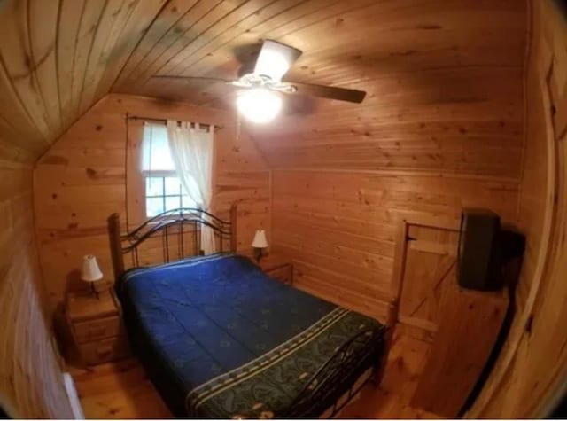 11 Cedar Ln, Putnam, IL 61560 - bedroom with wooden walls, wooden ceiling, lofted ceiling, and a ceiling fan