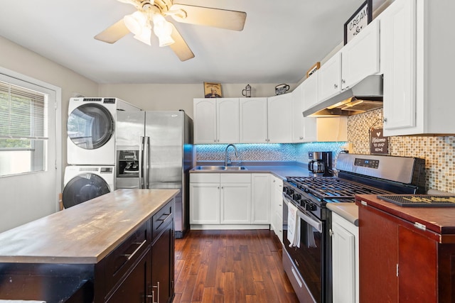 19 Briar Ln, Geneva, IL 60134 - kitchen with appliances with stainless steel finishes, stacked washer / dryer, under cabinet range hood, dark wood-type flooring, and a ceiling fan