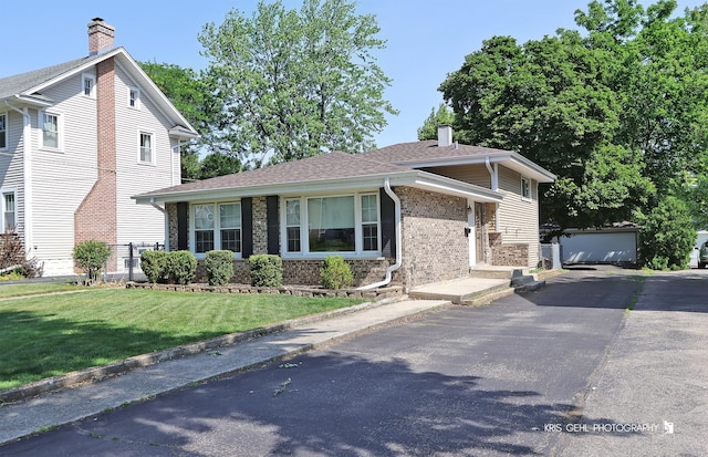 509 E Illinois St, Wheaton, IL 60187 - view of front of home featuring brick siding, an outdoor structure, a chimney, and a front yard