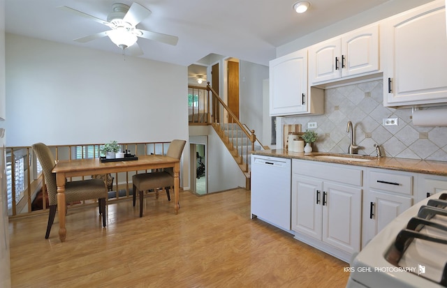 509 E Illinois St, Wheaton, IL 60187 - kitchen featuring white dishwasher, tasteful backsplash, light wood-style floors, and white cabinetry