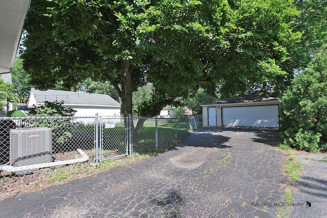 509 E Illinois St, Wheaton, IL 60187 - exterior space with a detached garage and an outdoor structure