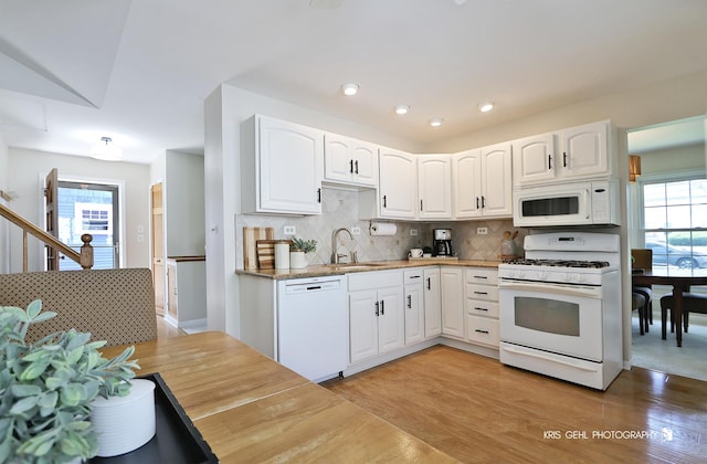509 E Illinois St, Wheaton, IL 60187 - kitchen featuring white appliances, healthy amount of natural light, backsplash, white cabinetry, and recessed lighting