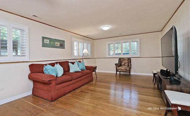509 E Illinois St, Wheaton, IL 60187 - living room with light wood finished floors, crown molding, and wainscoting