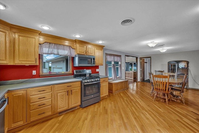 708 N 1950th Rd, Tonica, IL 61370 - kitchen with appliances with stainless steel finishes and light wood finished floors