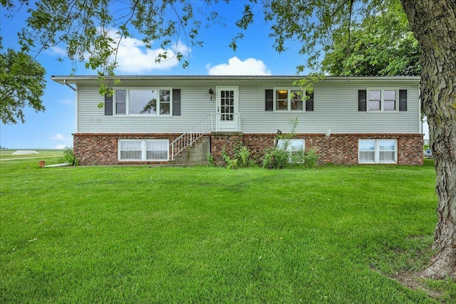 708 N 1950th Rd, Tonica, IL 61370 - view of front facade featuring a front lawn and brick siding