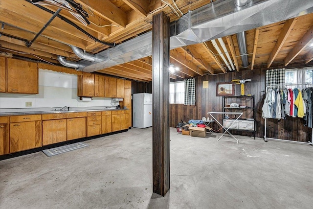 708 N 1950th Rd, Tonica, IL 61370 - below grade area featuring freestanding refrigerator and wood walls