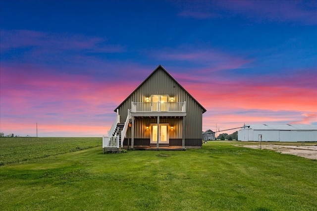 708 N 1950th Rd, Tonica, IL 61370 - rear view of property featuring board and batten siding, a yard, french doors, and a deck