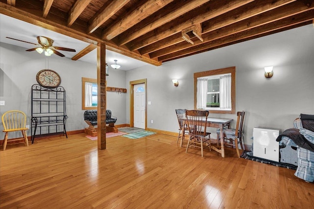 708 N 1950th Rd, Tonica, IL 61370 - dining room featuring light wood-style floors, beam ceiling, and a ceiling fan
