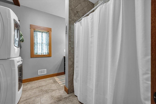 708 N 1950th Rd, Tonica, IL 61370 - laundry room with stacked washing machine and dryer and baseboards