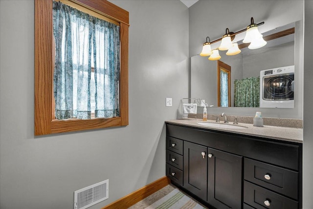 708 N 1950th Rd, Tonica, IL 61370 - bathroom with washer / clothes dryer and vanity
