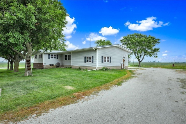 708 N 1950th Rd, Tonica, IL 61370 - single story home with a front lawn and driveway