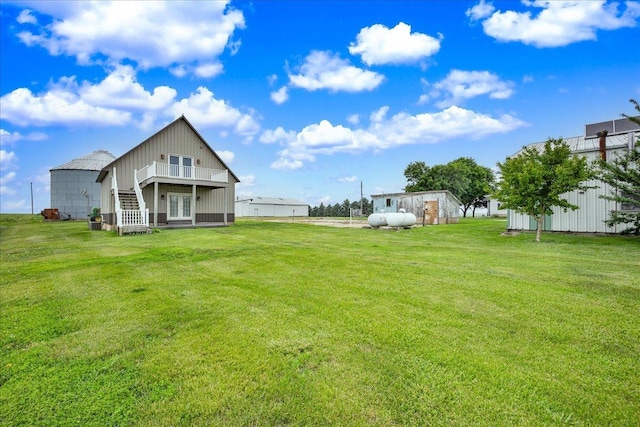 708 N 1950th Rd, Tonica, IL 61370 - view of green lawn with french doors and a wooden deck