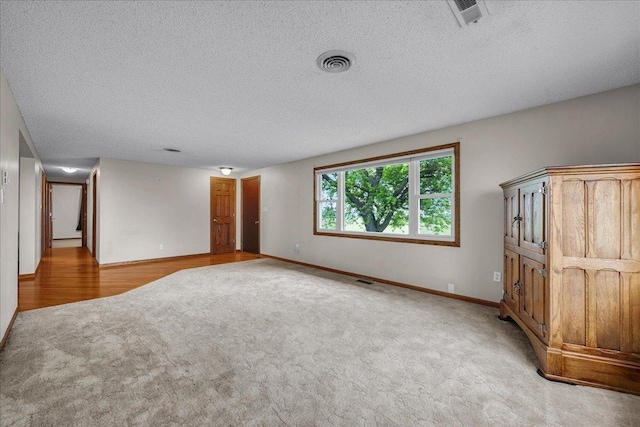 708 N 1950th Rd, Tonica, IL 61370 - spare room with light carpet and a textured ceiling