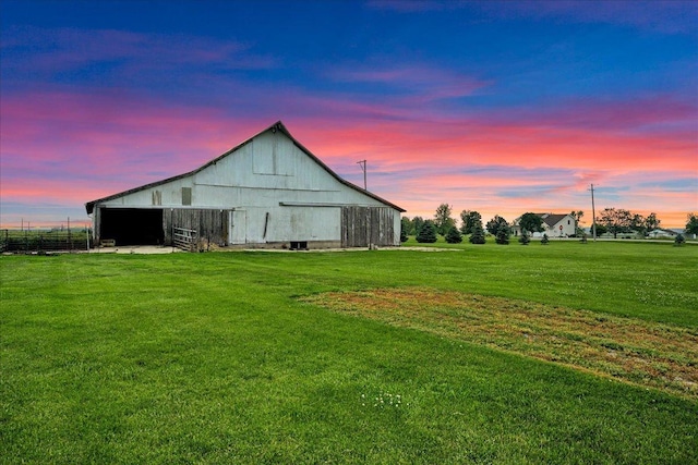 708 N 1950th Rd, Tonica, IL 61370 - outdoor structure at dusk featuring a yard and a barn