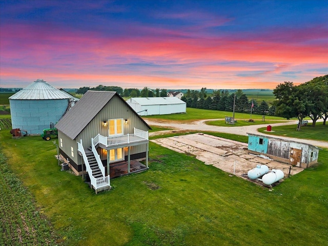 708 N 1950th Rd, Tonica, IL 61370 - rear view of house with a yard, driveway, and stairs