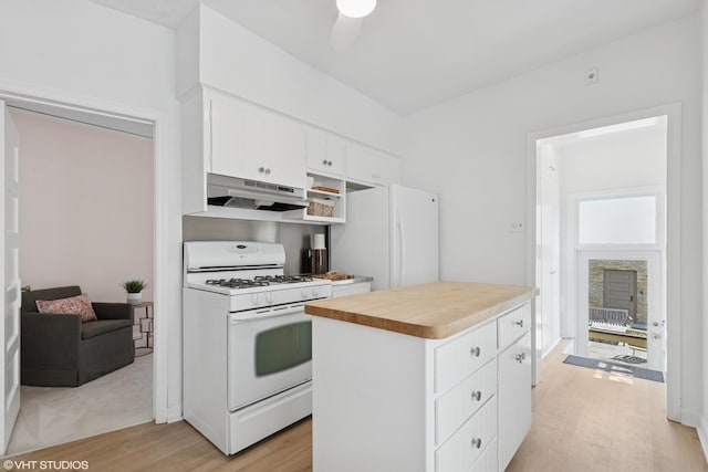 2635 Poplar Ave, Evanston, IL 60201 - kitchen featuring white appliances, under cabinet range hood, light wood-style flooring, white cabinets, and ceiling fan